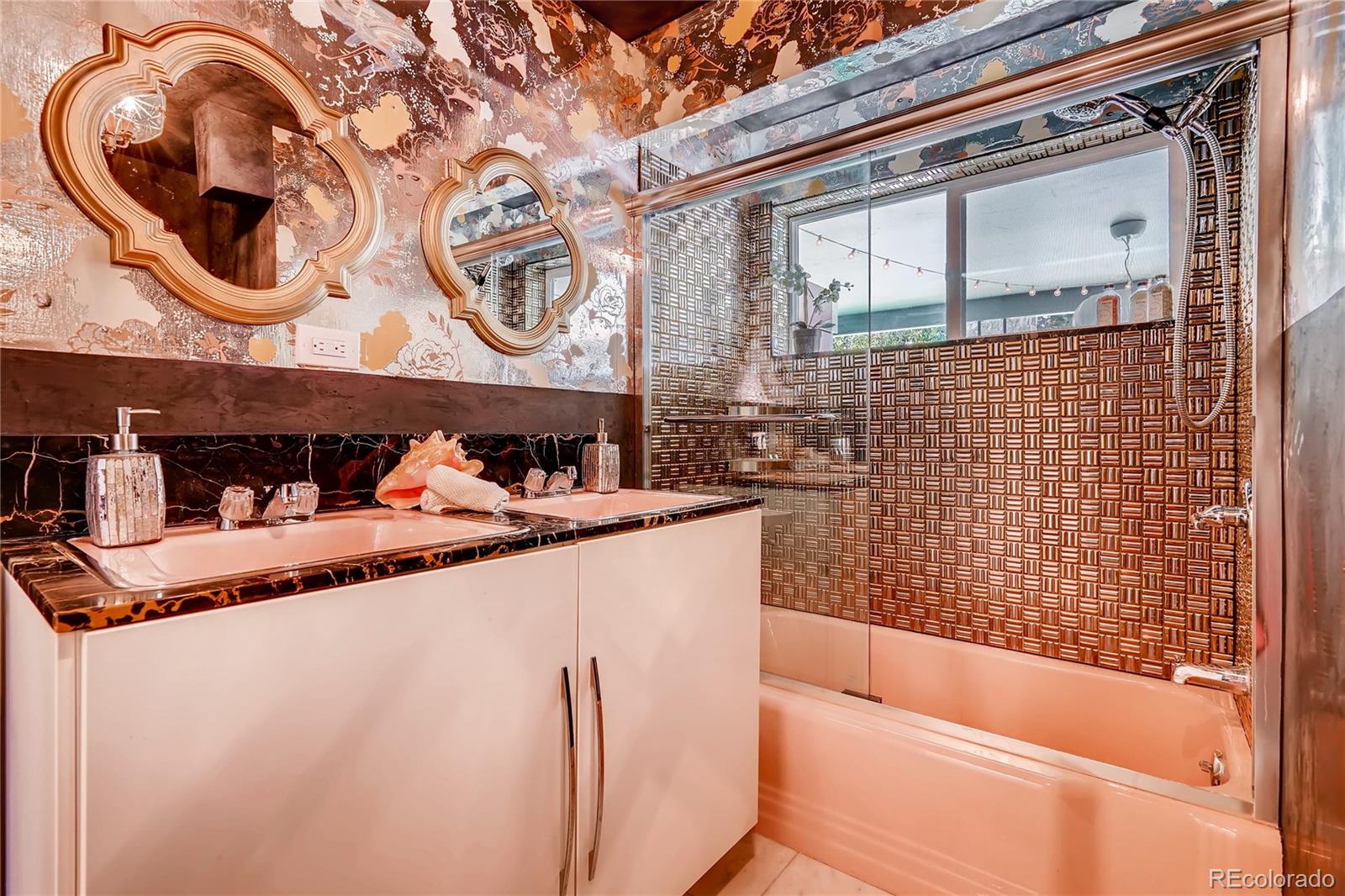 4295 North Harlan Street Wheat Ridge, CO 80033 - Photo 22 of 30 a bathroom with a granite countertop sink and a mirror