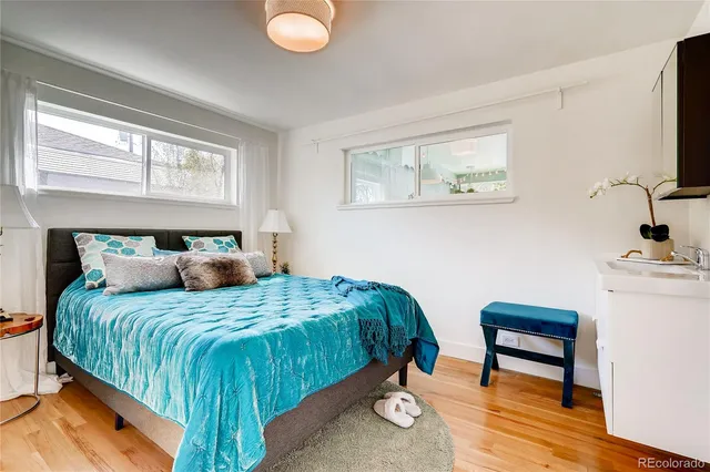 a bedroom with a bed and a desk