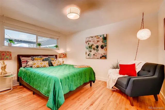 a bedroom with a bed and window