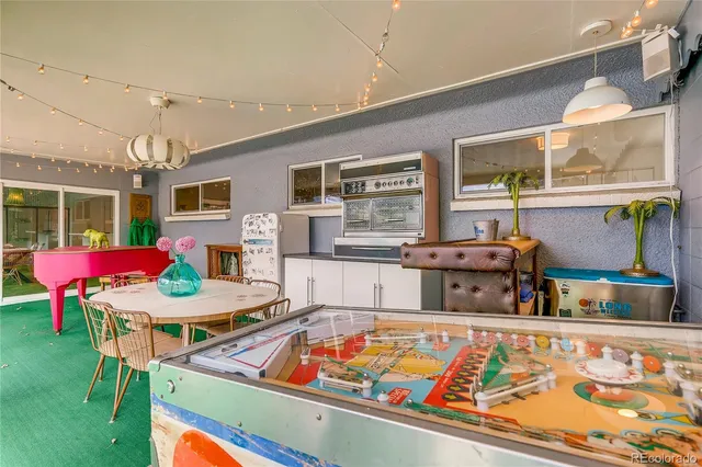 a dining room with furniture and window