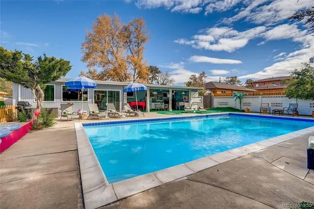 a view of a house with swimming pool