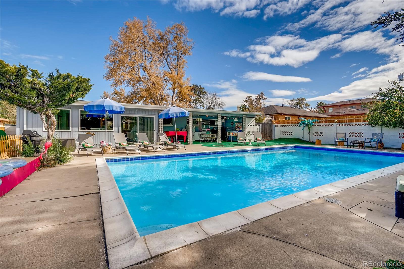 4295 North Harlan Street Wheat Ridge, CO 80033 - Photo 4 of 30 a view of a house with swimming pool