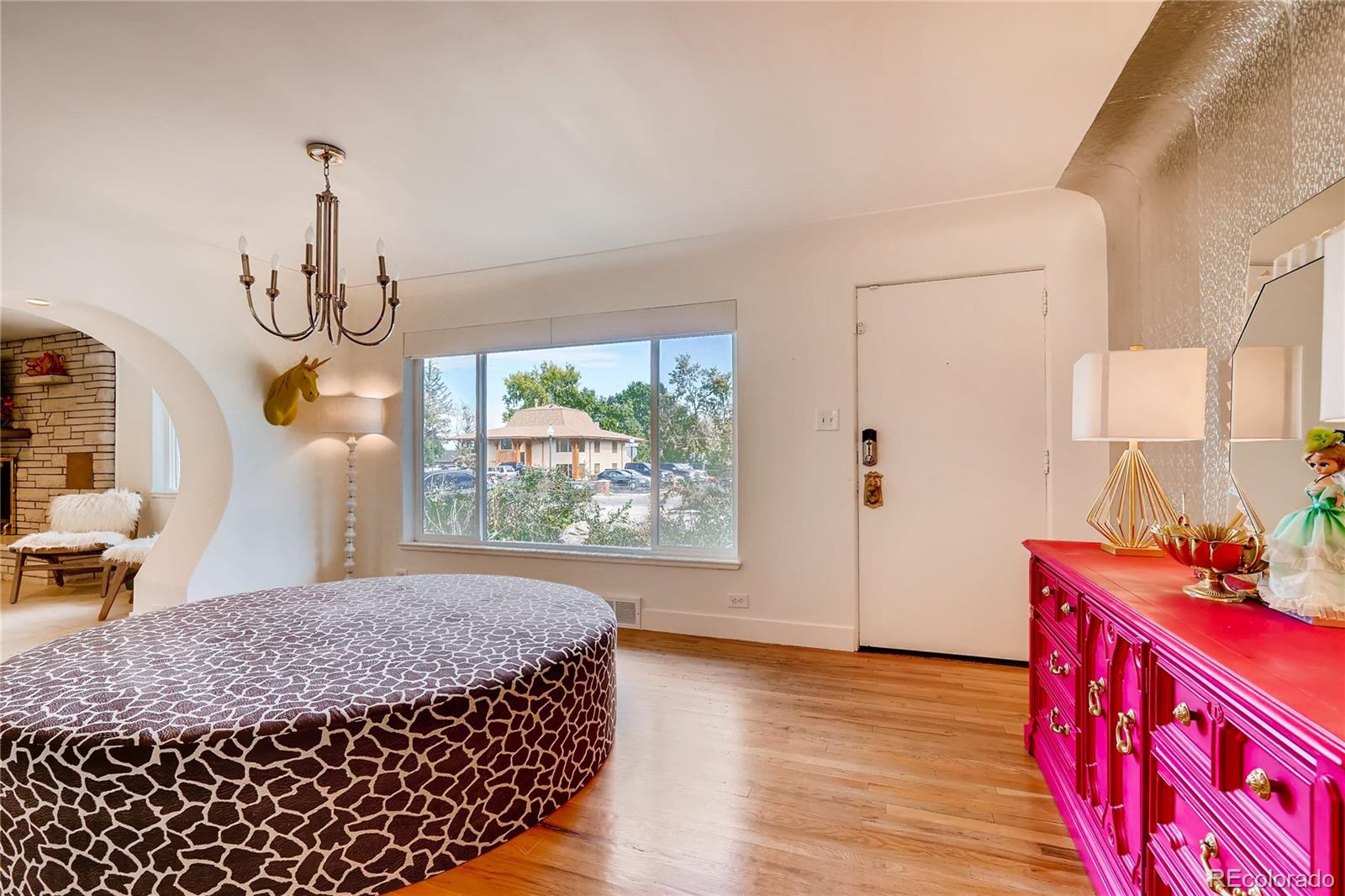 4295 North Harlan Street Wheat Ridge, CO 80033 - Photo 5 of 30 a bedroom with bed and wooden floor