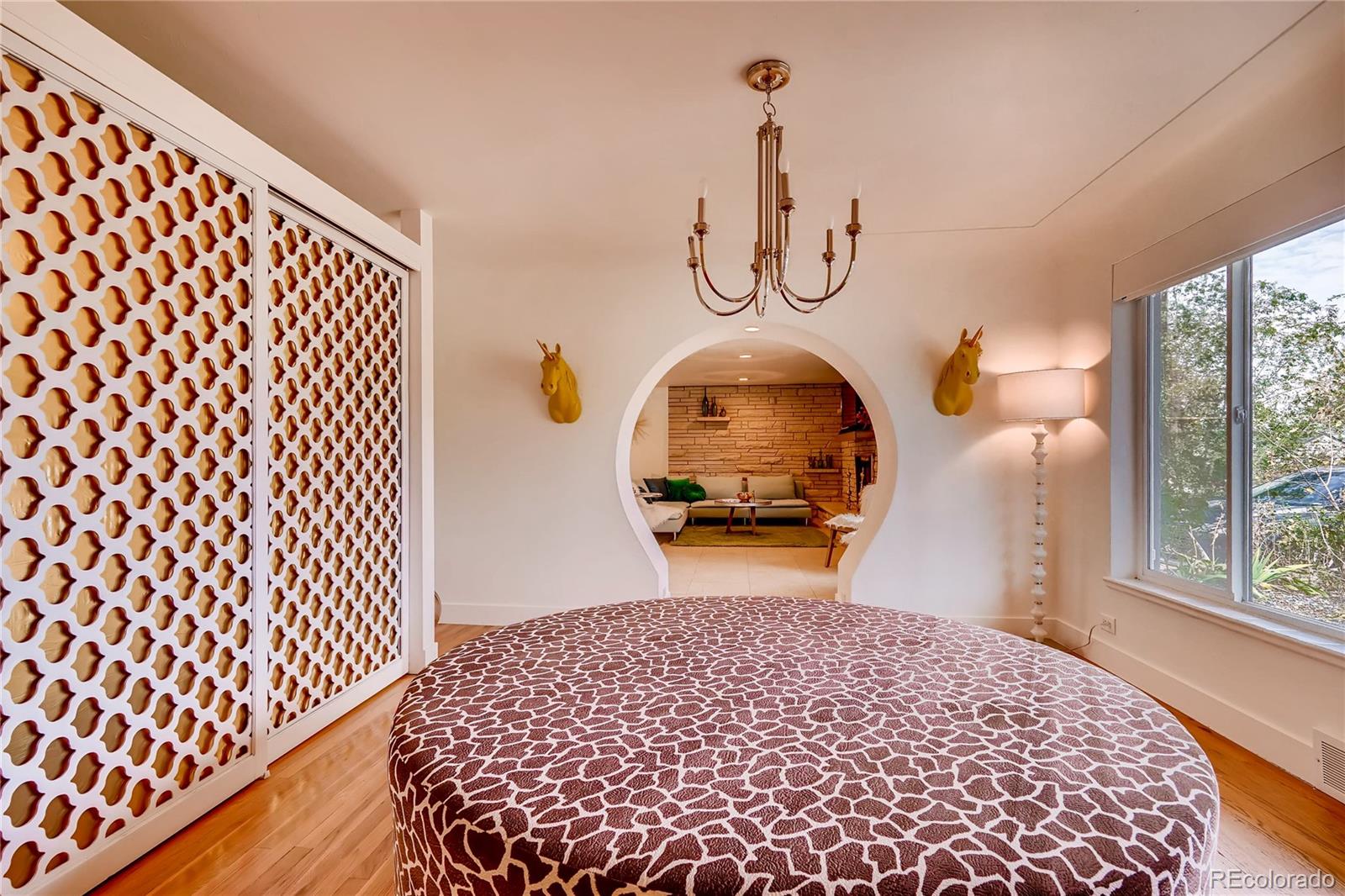4295 North Harlan Street Wheat Ridge, CO 80033 - Photo 6 of 30 a bedroom with bed and wooden floor