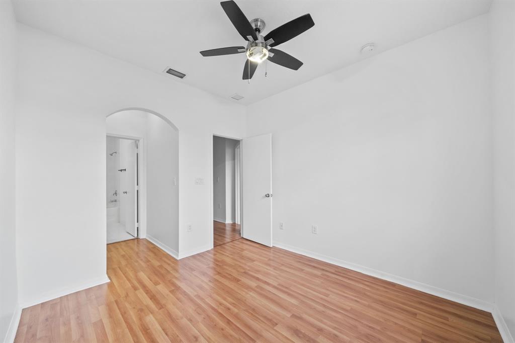 717 Southwest 107th Avenue, Unit 2203 Pembroke Pines, FL 33025 - Photo 15 of 22 a view of a livingroom with a hardwood floor and a ceiling fan