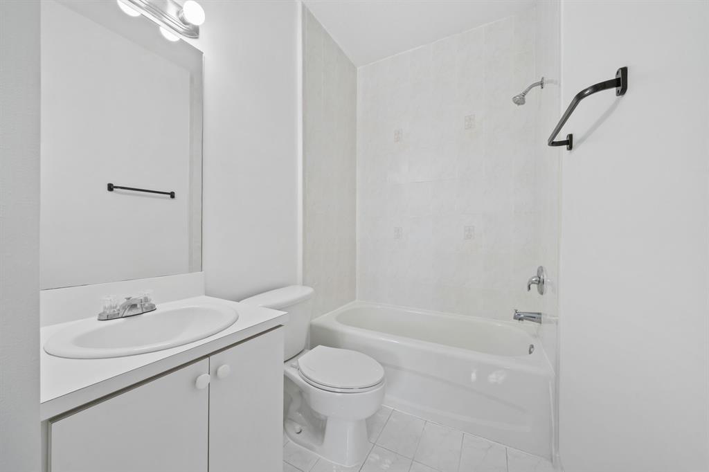 717 Southwest 107th Avenue, Unit 2203 Pembroke Pines, FL 33025 - Photo 19 of 22 a bathroom with a sink toilet and shower