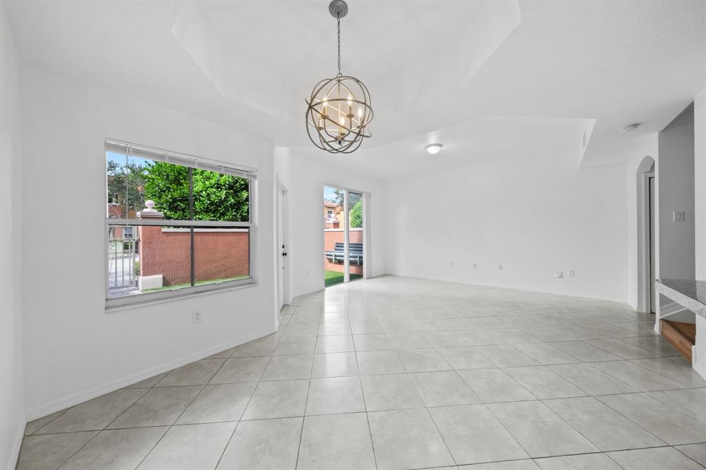 717 Southwest 107th Avenue, Unit 2203 Pembroke Pines, FL 33025 - Photo 3 of 22 a view of an empty room with a window