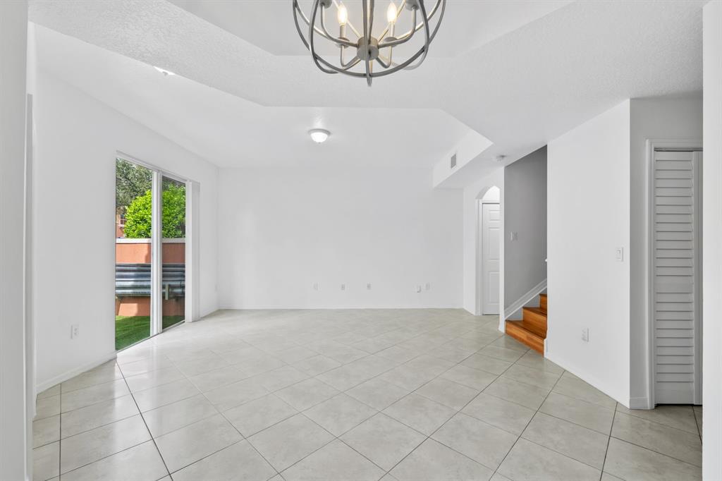 717 Southwest 107th Avenue, Unit 2203 Pembroke Pines, FL 33025 - Photo 6 of 22 a view of an empty room with a window