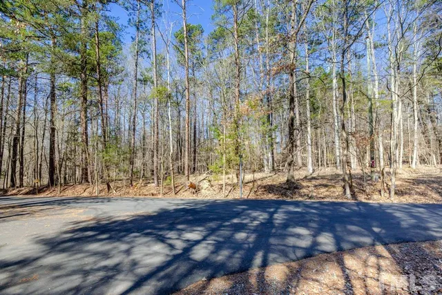a view of outdoor space with wooden fence