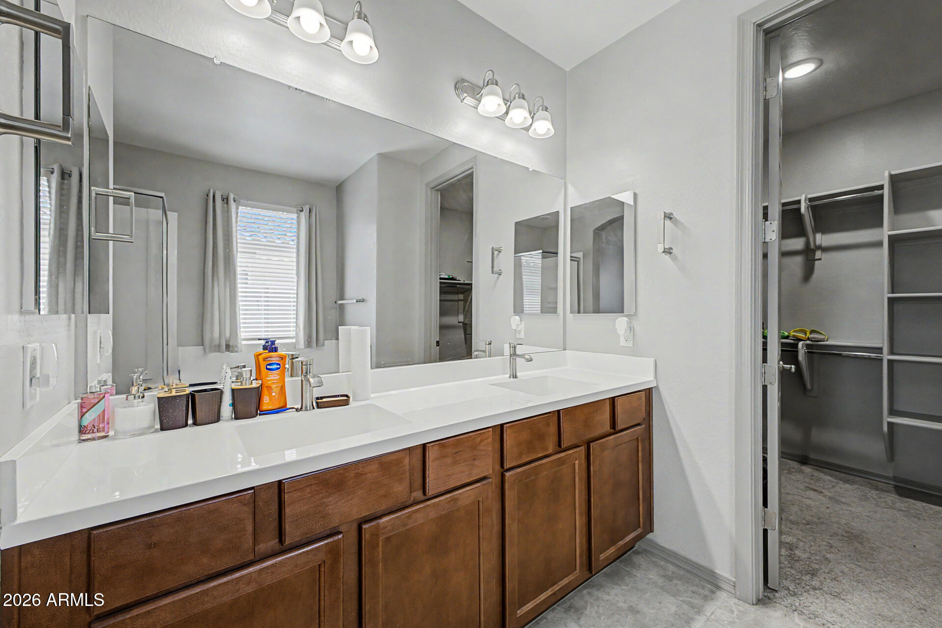 15088 West Garfield Street Goodyear, AZ 85338 - Photo 15 of 31 a bathroom with a double vanity sink mirror and double