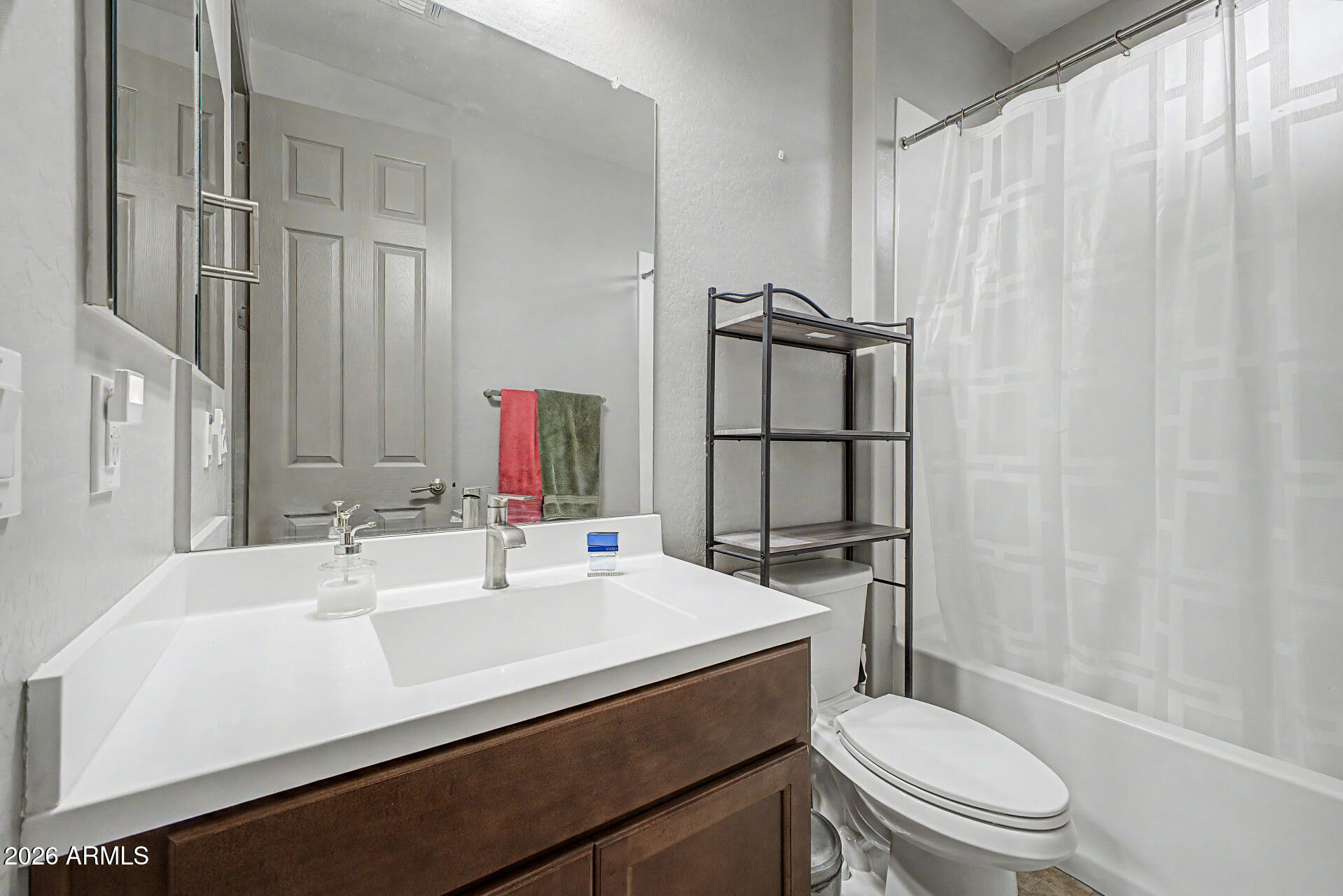 15088 West Garfield Street Goodyear, AZ 85338 - Photo 20 of 31 a bathroom with a sink a toilet and shower