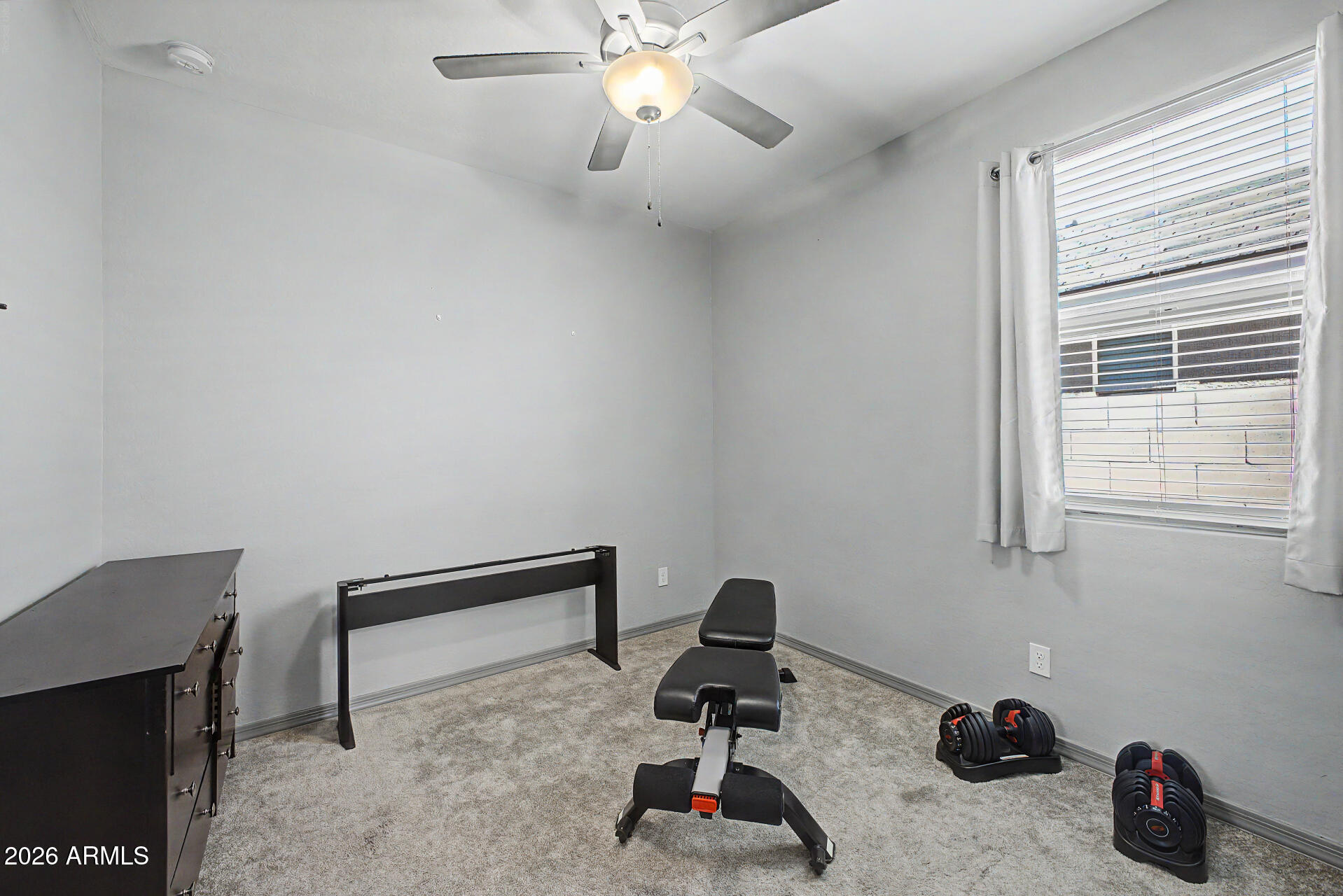 15088 West Garfield Street Goodyear, AZ 85338 - Photo 21 of 31 a work room with furniture and gym equipment