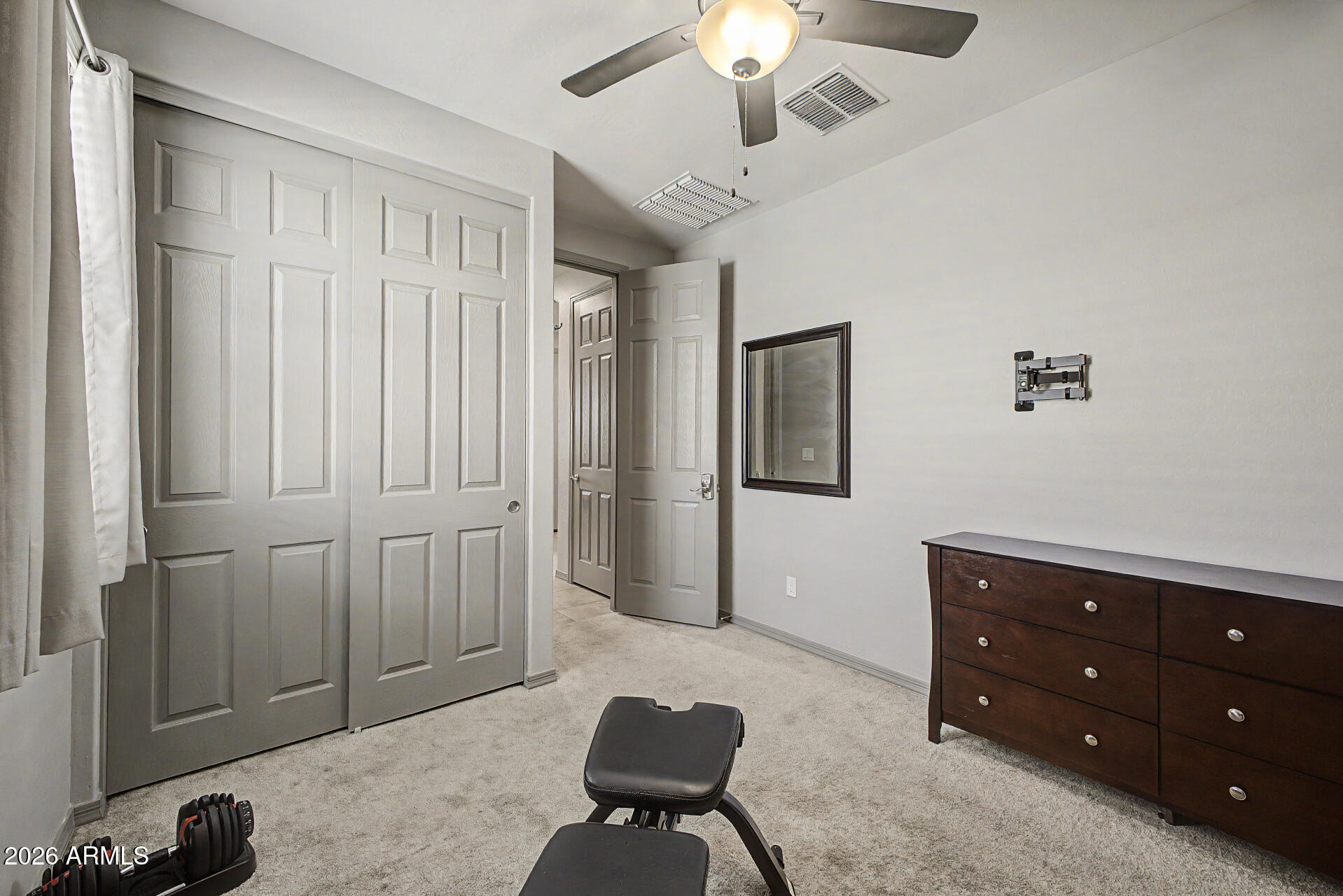 15088 West Garfield Street Goodyear, AZ 85338 - Photo 22 of 31 wooden floor and windows in a room