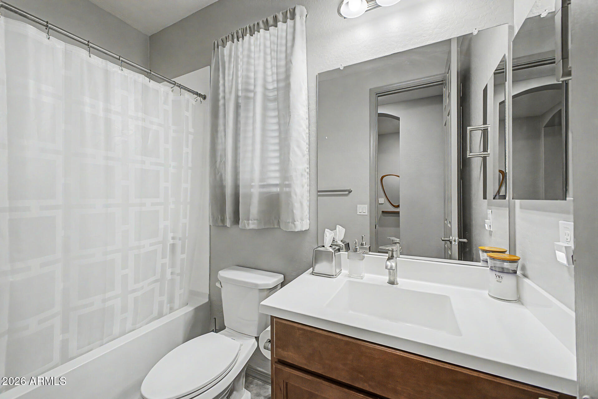 15088 West Garfield Street Goodyear, AZ 85338 - Photo 23 of 31 a bathroom with a sink toilet and shower