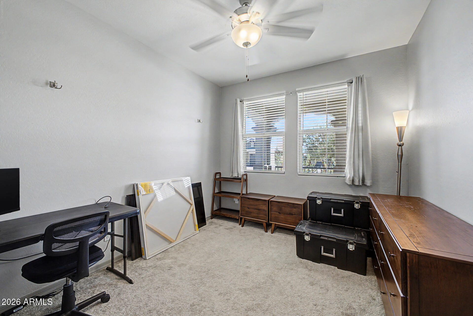 15088 West Garfield Street Goodyear, AZ 85338 - Photo 24 of 31 a bedroom with furniture and a window