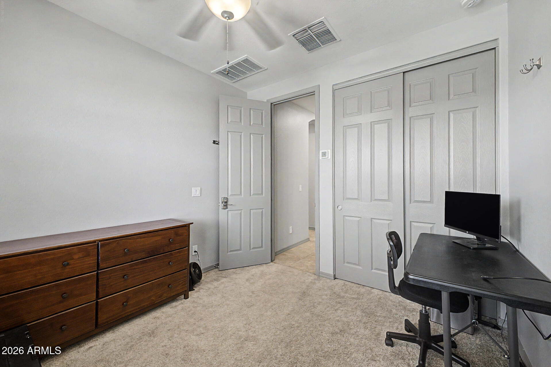 15088 West Garfield Street Goodyear, AZ 85338 - Photo 25 of 31 a view of a workspace with furniture and a window