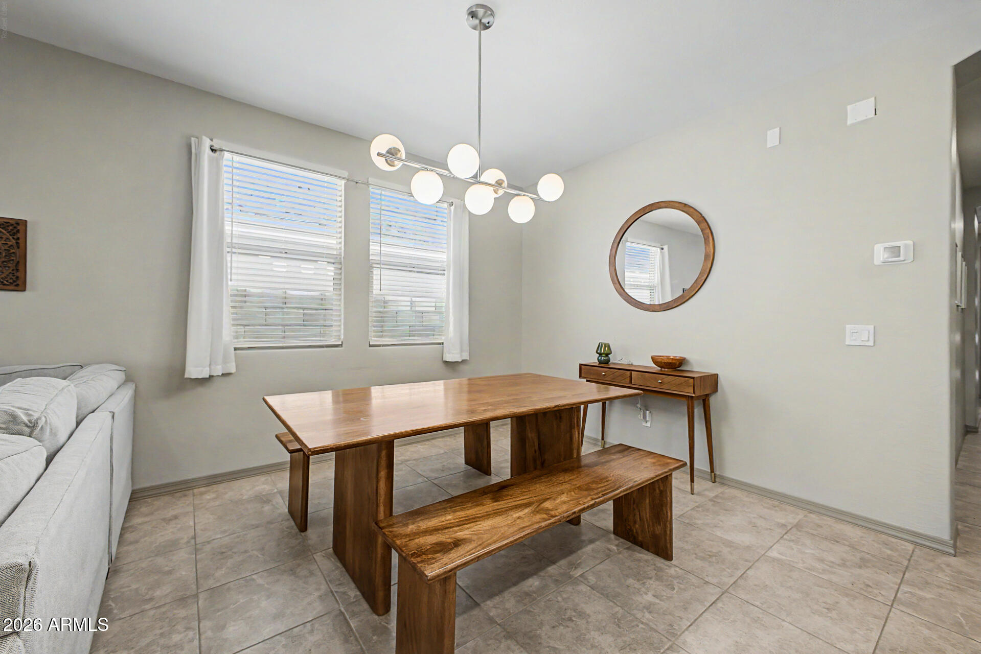 15088 West Garfield Street Goodyear, AZ 85338 - Photo 7 of 31 a room with table chairs and window