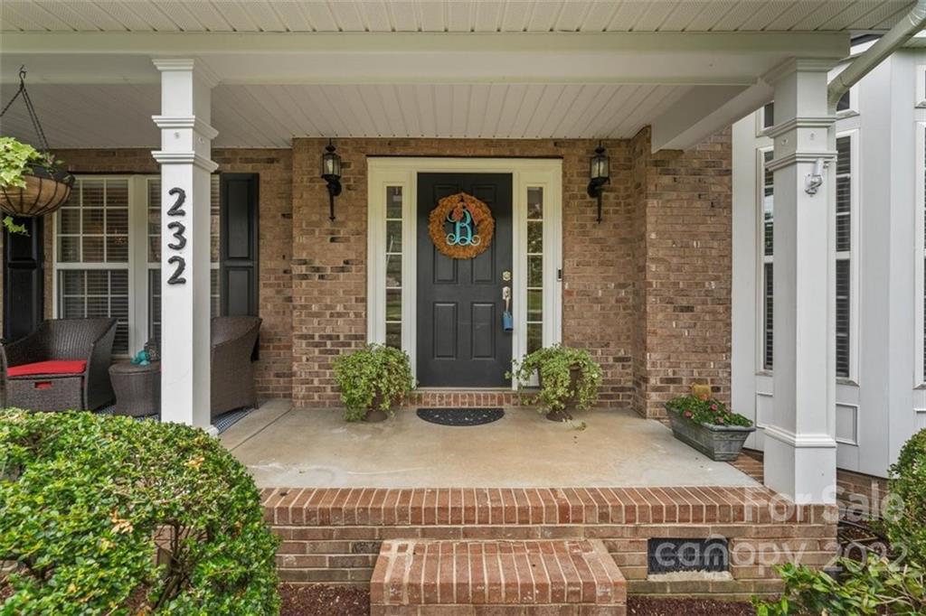 232 Choate Avenue Fort Mill, SC 29708 - Photo 2 of 47 a front view of a building with potted plants