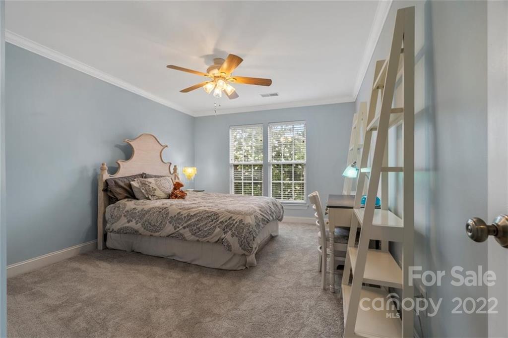 232 Choate Avenue Fort Mill, SC 29708 - Photo 21 of 47 a bed room with a bed and a chandelier