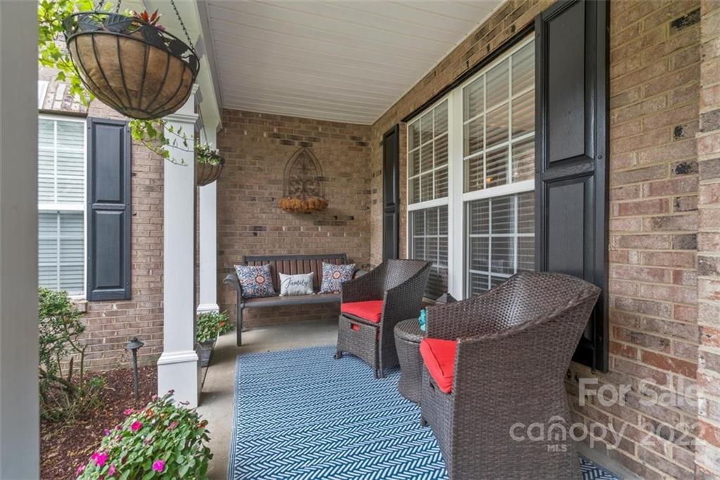 232 Choate Avenue Fort Mill, SC 29708 - Photo 4 of 47 a balcony with table and chairs