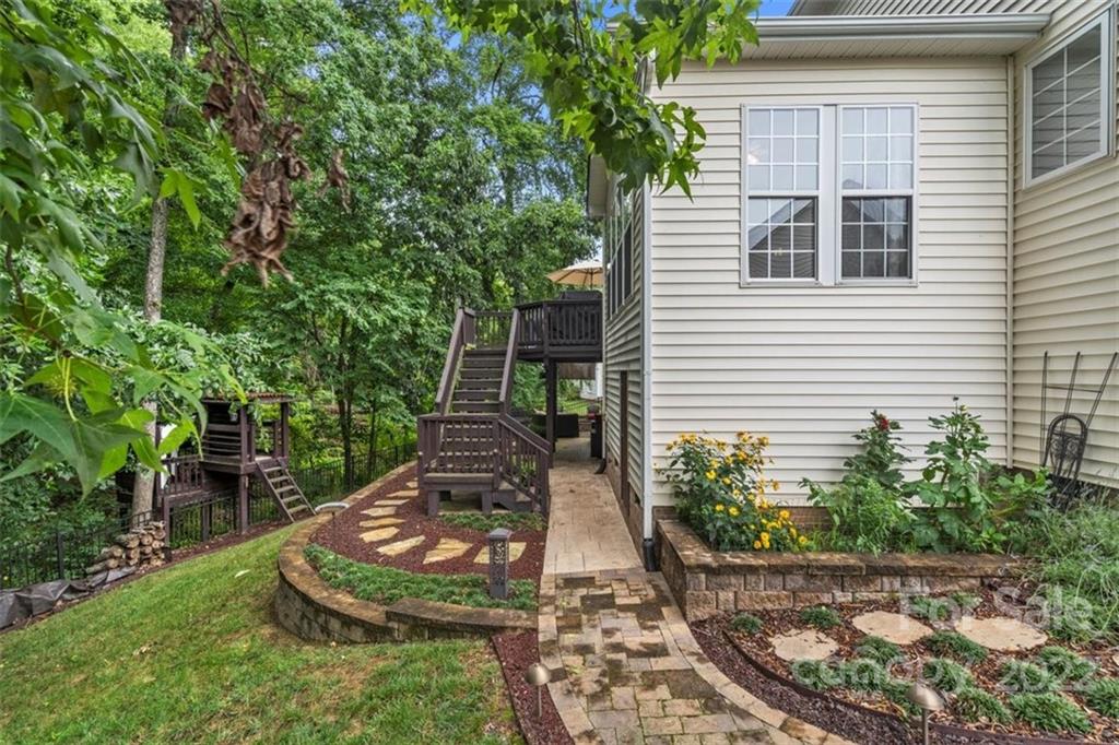 232 Choate Avenue Fort Mill, SC 29708 - Photo 44 of 47 a view of a backyard with chair and potted plants
