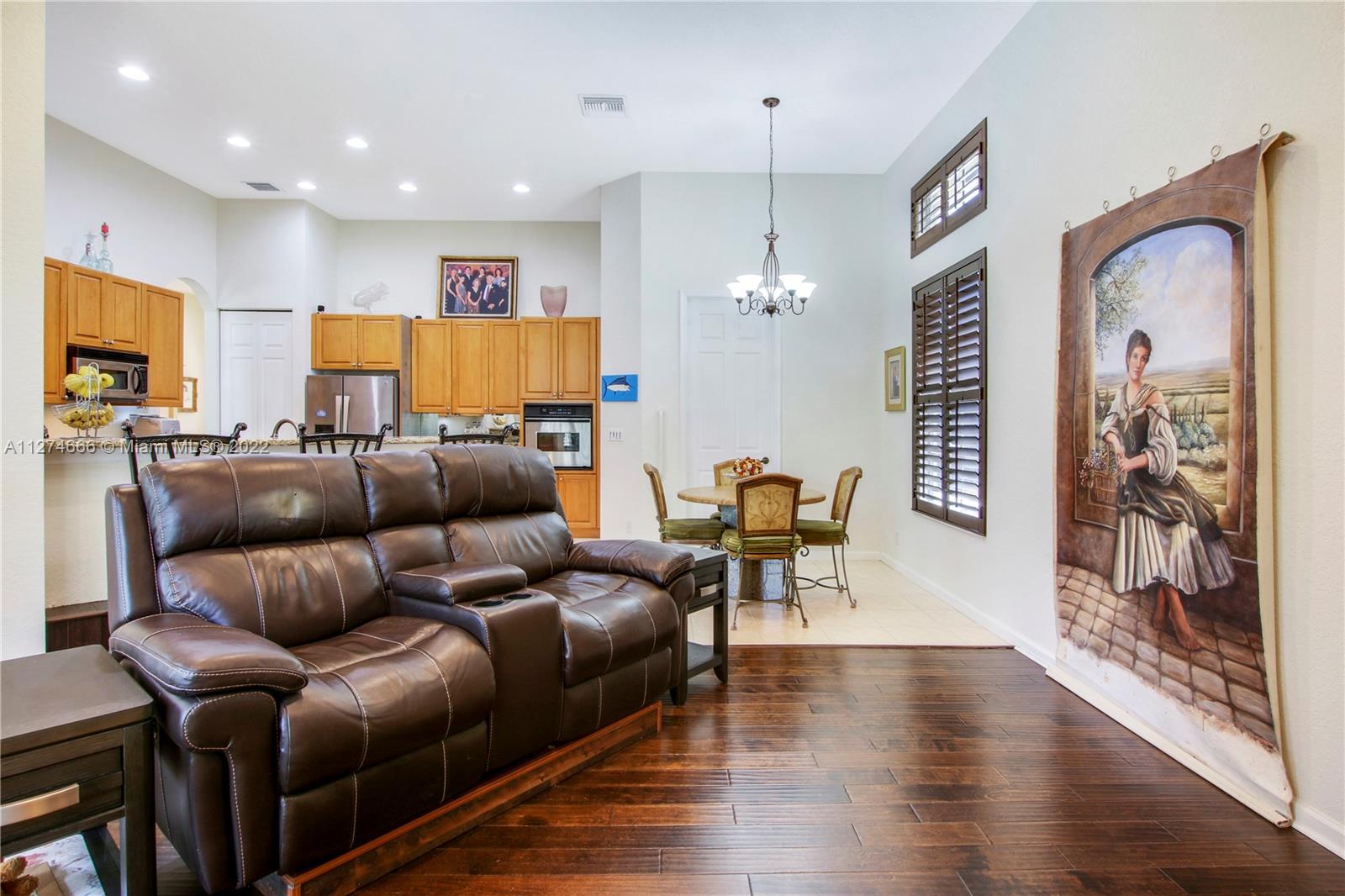 116 Via Rosina Jupiter, FL 33458 - Photo 11 of 32 a living room with furniture and wooden floor
