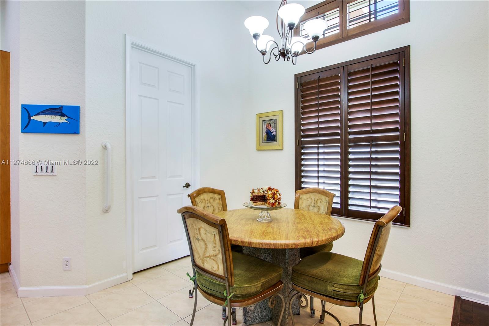 116 Via Rosina Jupiter, FL 33458 - Photo 13 of 32 a view of a dining room with furniture and chandelier