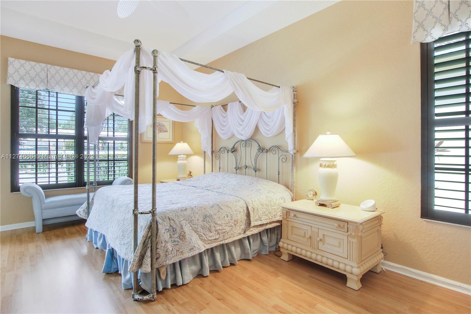 116 Via Rosina Jupiter, FL 33458 - Photo 14 of 32 a bedroom with a bed wooden floor and window