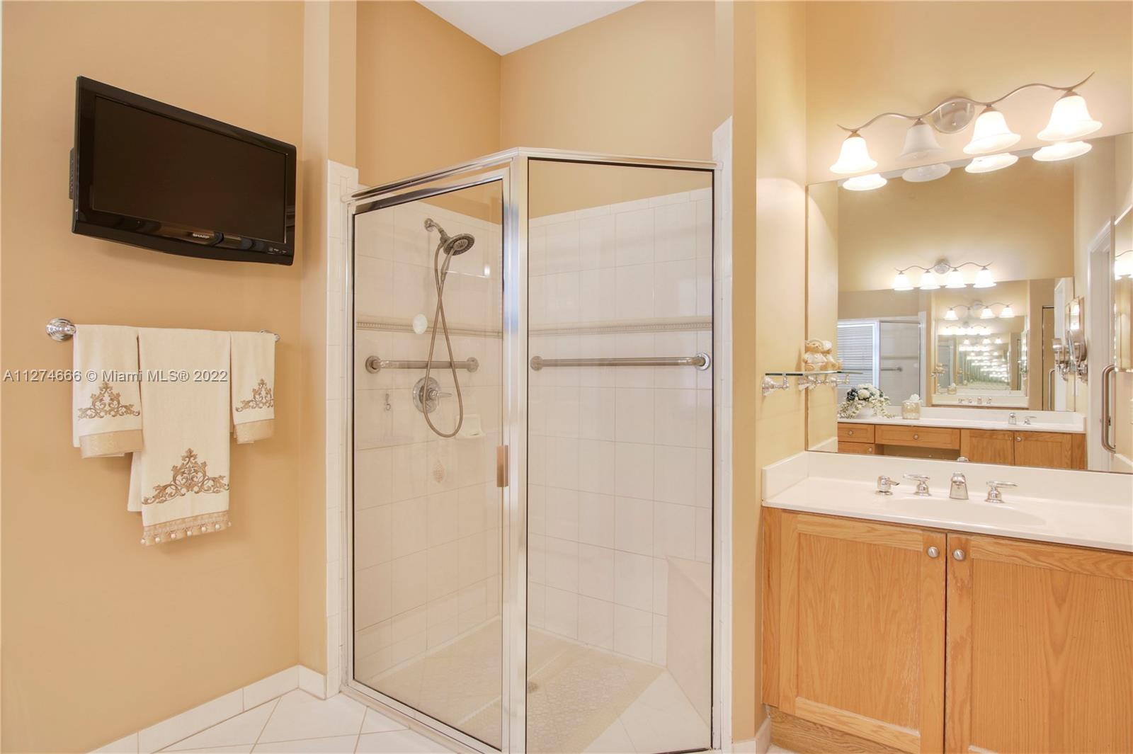 116 Via Rosina Jupiter, FL 33458 - Photo 16 of 32 a bathroom with a bathtub and a shower