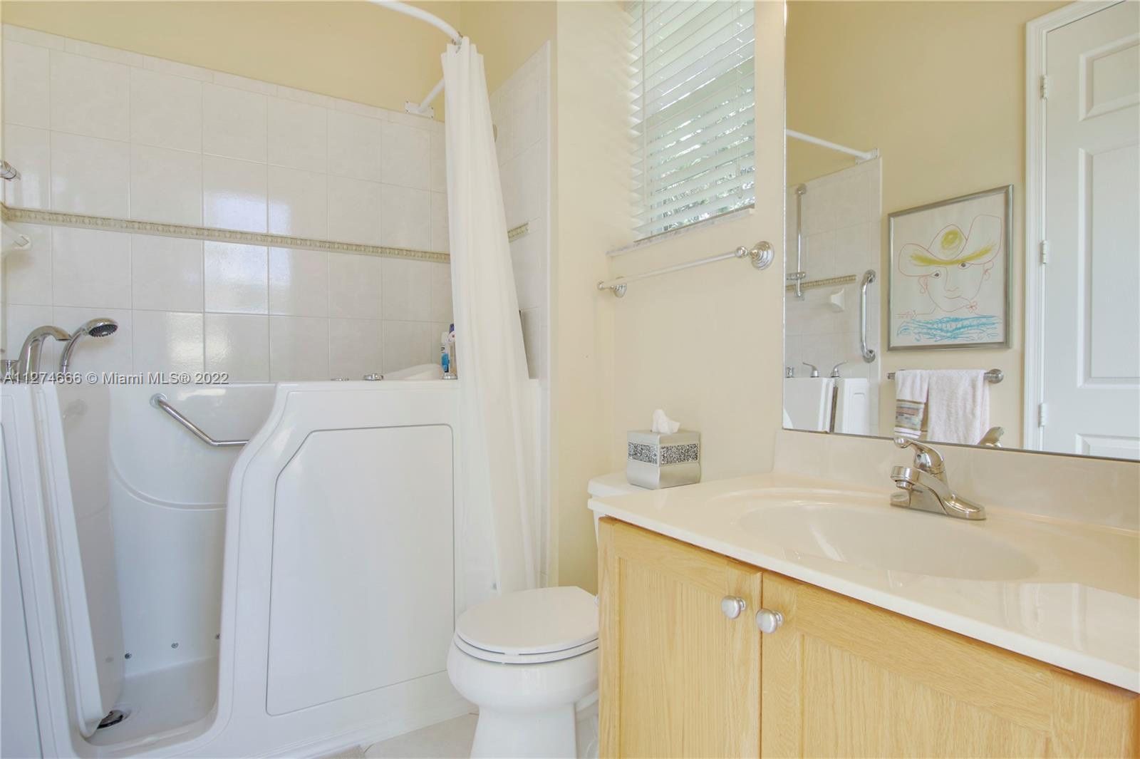 116 Via Rosina Jupiter, FL 33458 - Photo 21 of 32 a bathroom with a sink toilet and shower