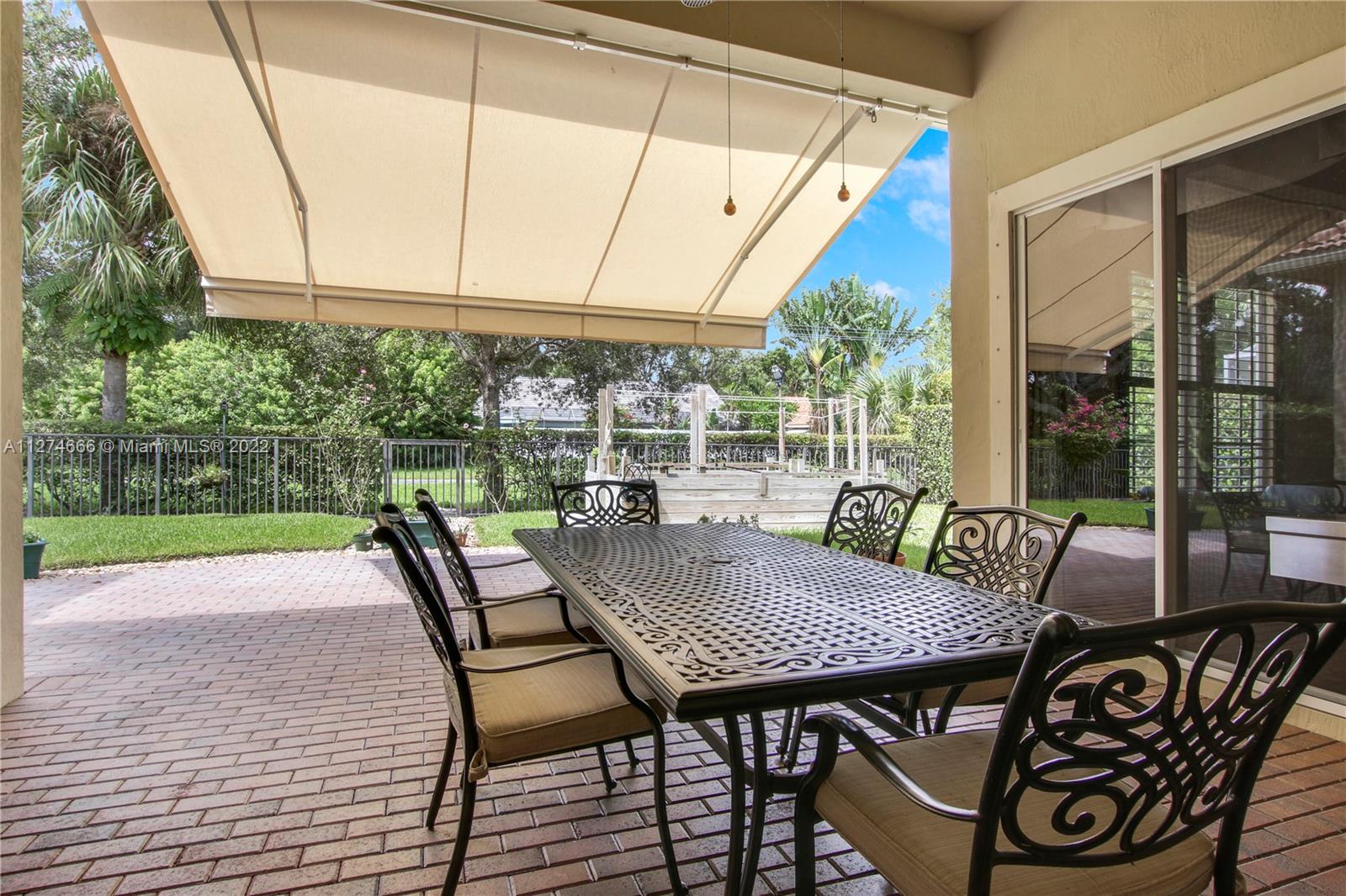 116 Via Rosina Jupiter, FL 33458 - Photo 23 of 32 a view of a patio with a table chairs and a table