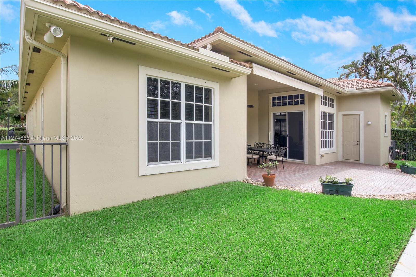 116 Via Rosina Jupiter, FL 33458 - Photo 24 of 32 a front view of a house with a yard and porch