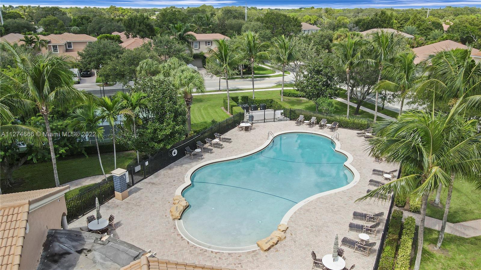 116 Via Rosina Jupiter, FL 33458 - Photo 27 of 32 an aerial view of a house with a yard and lake view