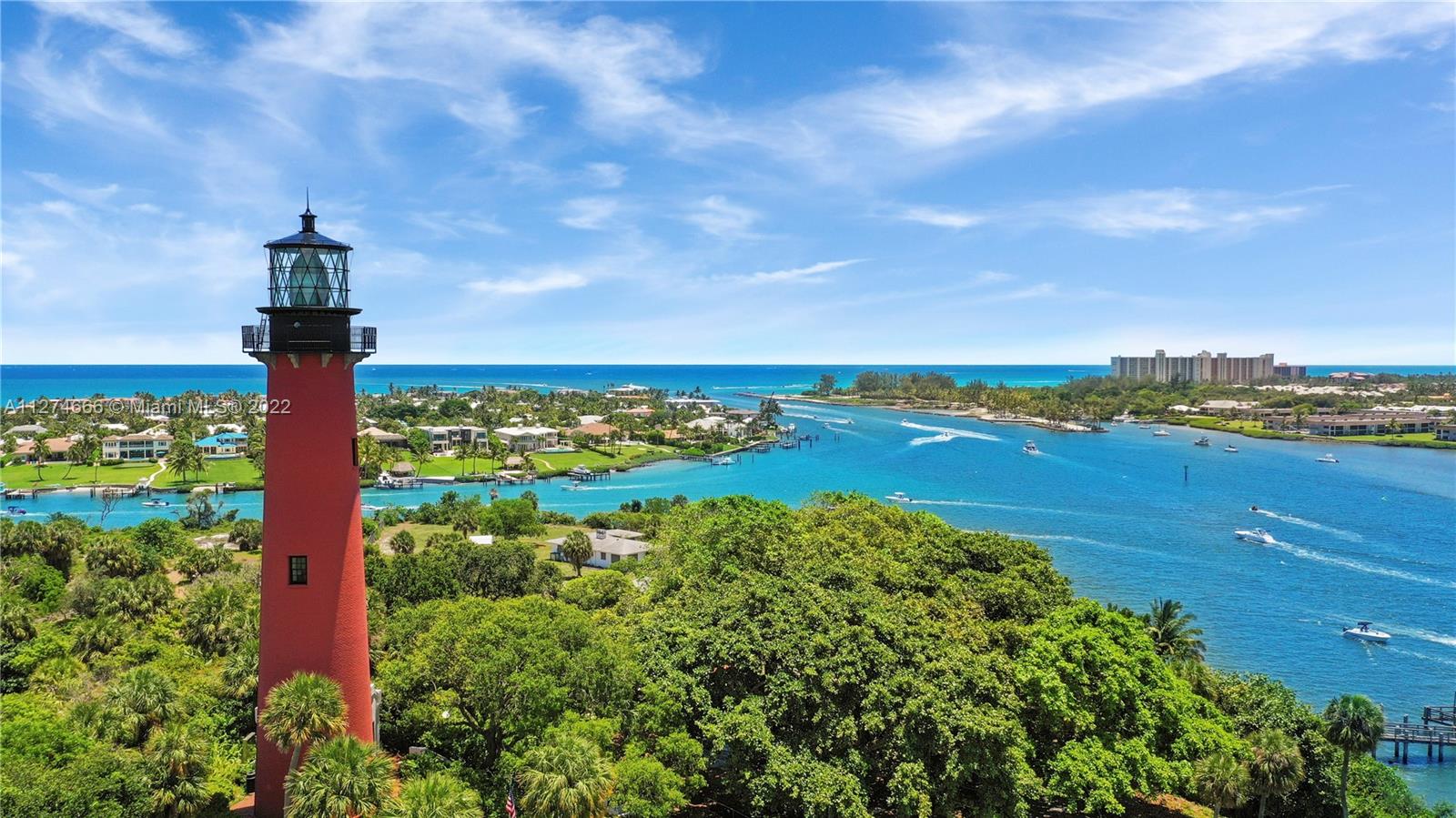 116 Via Rosina Jupiter, FL 33458 - Photo 29 of 32 a view of a lake with a mountain in the background