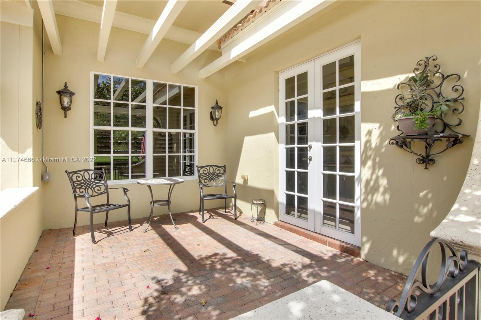 116 Via Rosina Jupiter, FL 33458 - Photo 3 of 32 a building outdoor space with patio furniture and windows