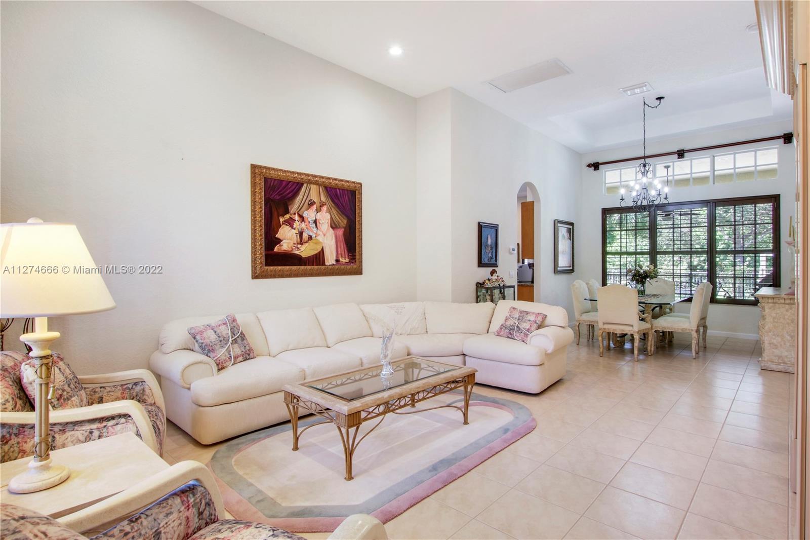 116 Via Rosina Jupiter, FL 33458 - Photo 6 of 32 a living room with furniture and a large window