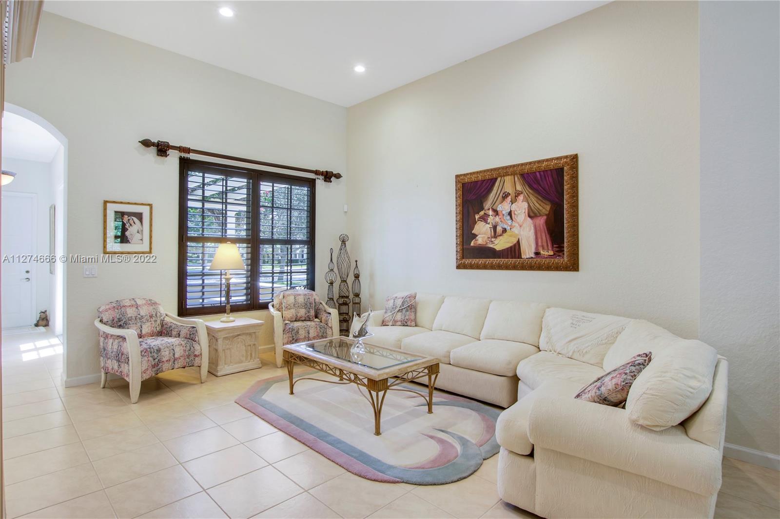 116 Via Rosina Jupiter, FL 33458 - Photo 7 of 32 a living room with furniture and a window