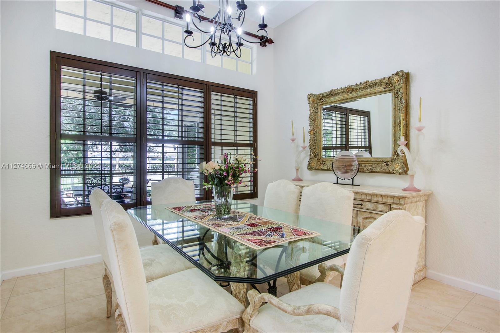 116 Via Rosina Jupiter, FL 33458 - Photo 8 of 32 a view of a dining room with furniture window and outside view