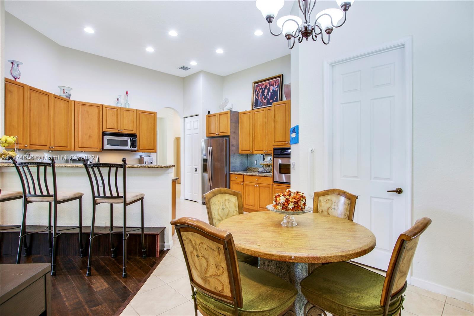 116 Via Rosina Jupiter, FL 33458 - Photo 10 of 32 a view of a dining room with furniture and wooden floor