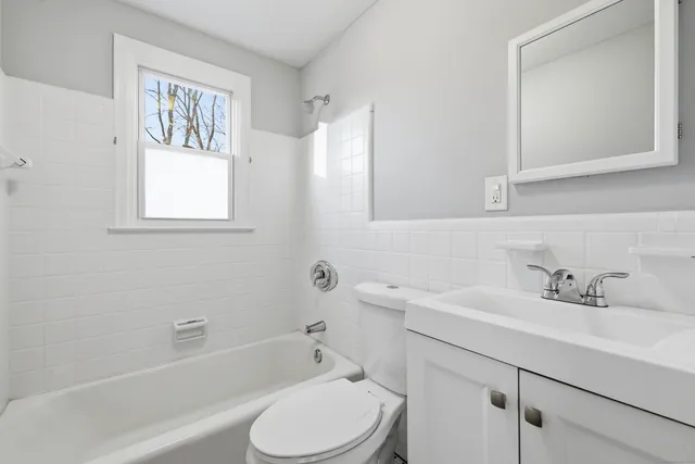 a bathroom with a sink toilet and bathtub