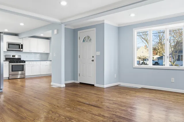 a view of kitchen with wooden floor and window