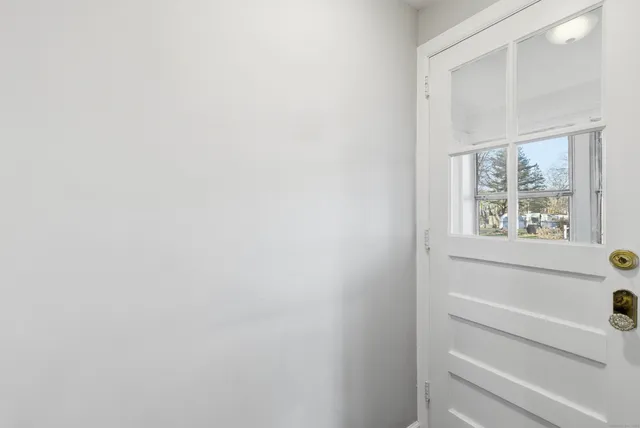 a bathroom with a bathtub and window