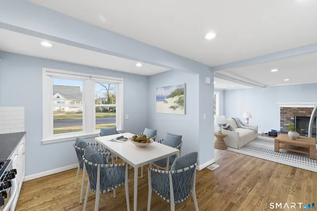 a view of a dining room with furniture window and outside view