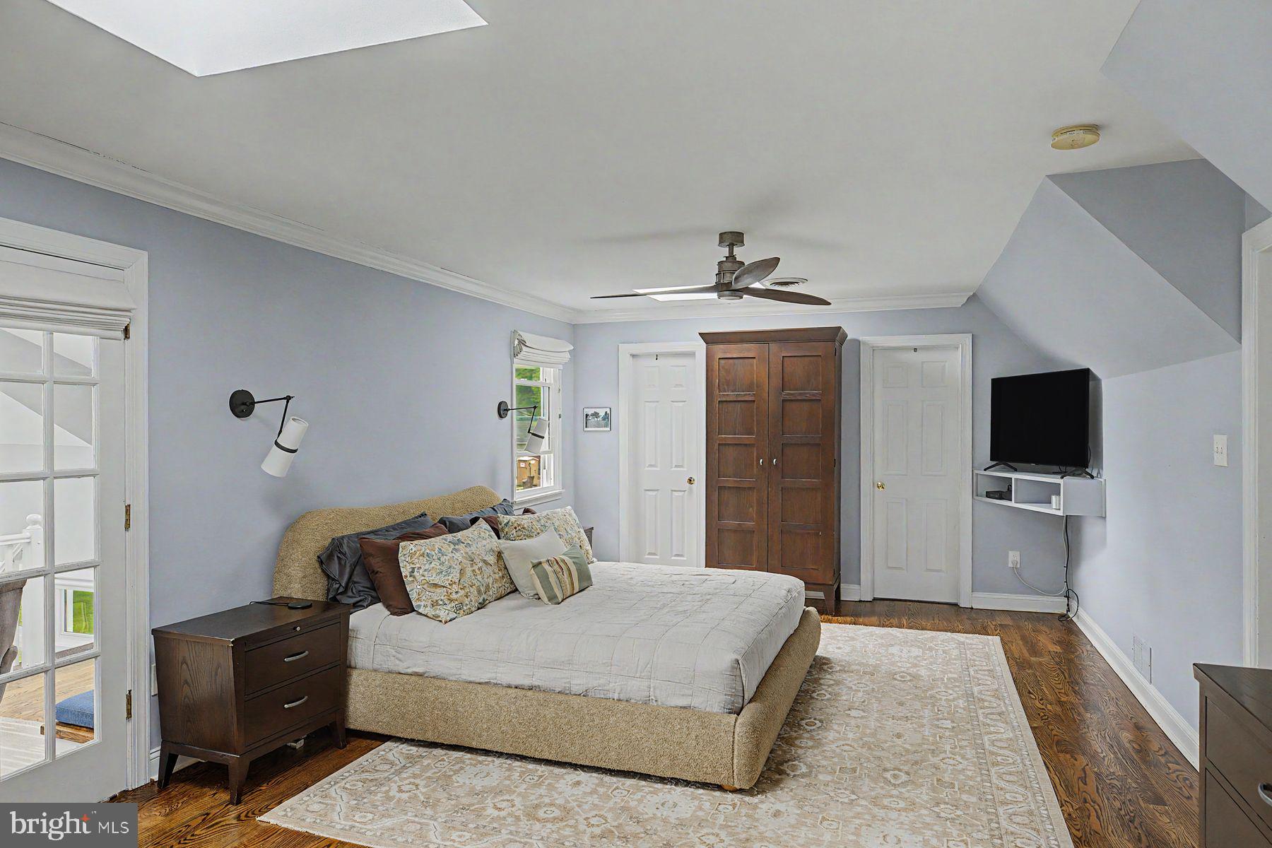 4009 Smoke Road Doylestown, PA 18902 - Photo 30 of 52 a bedroom with a bed and a flat screen tv