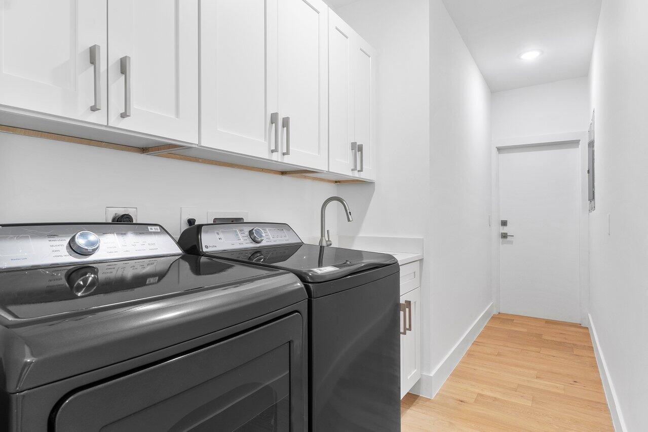 2299 Northwest 30th Road Boca Raton, FL 33431 - Photo 33 of 50 a close view of laundry room with two washing machine