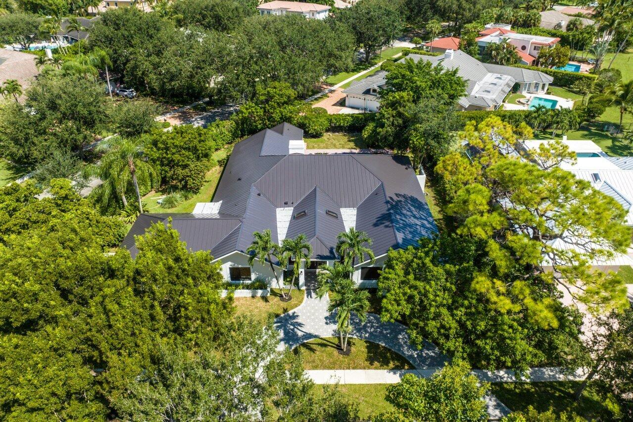 2299 Northwest 30th Road Boca Raton, FL 33431 - Photo 34 of 50 an aerial view of a house with a yard and large trees