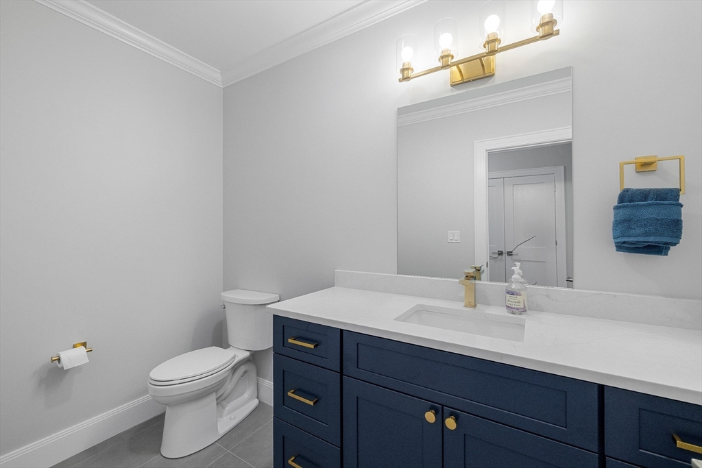 4 Aerial Street Lexington, MA 02421 - Photo 29 of 35 a bathroom with a sink a toilet and mirror