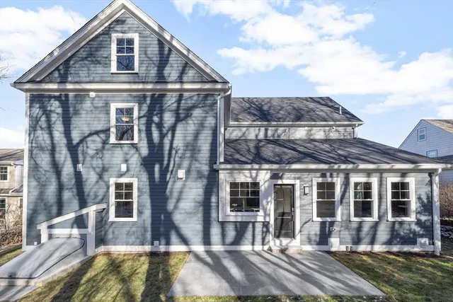 a front view of a house with a yard balcony