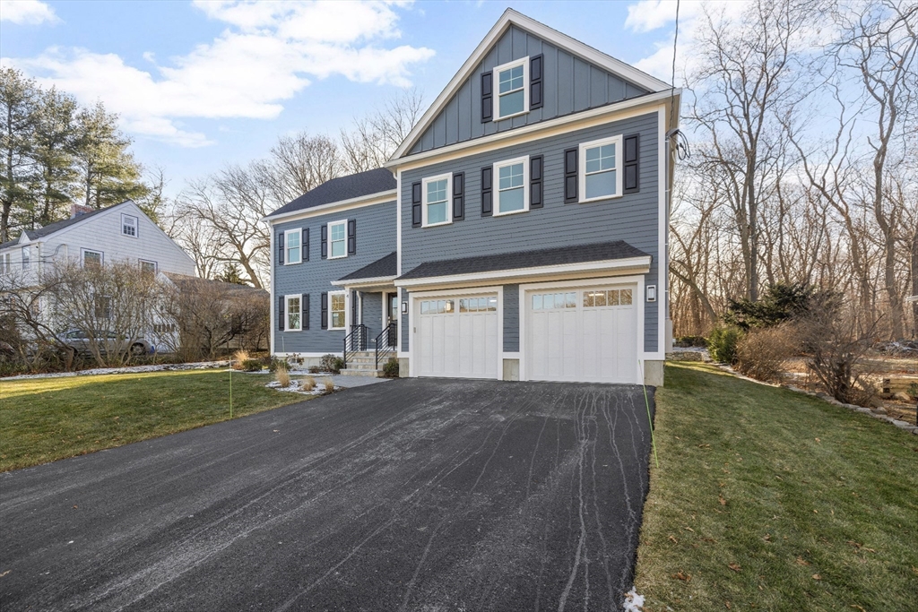 4 Aerial Street Lexington, MA 02421 - Photo 35 of 35 a front view of a house with a yard and garage