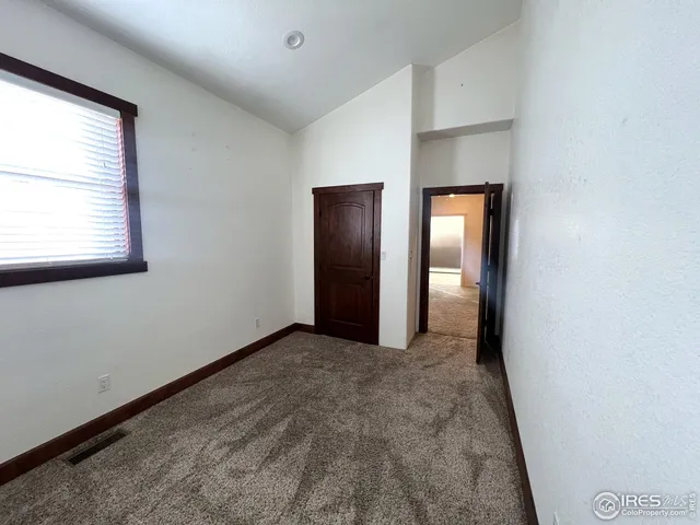 a view of room with a ceiling fan and window